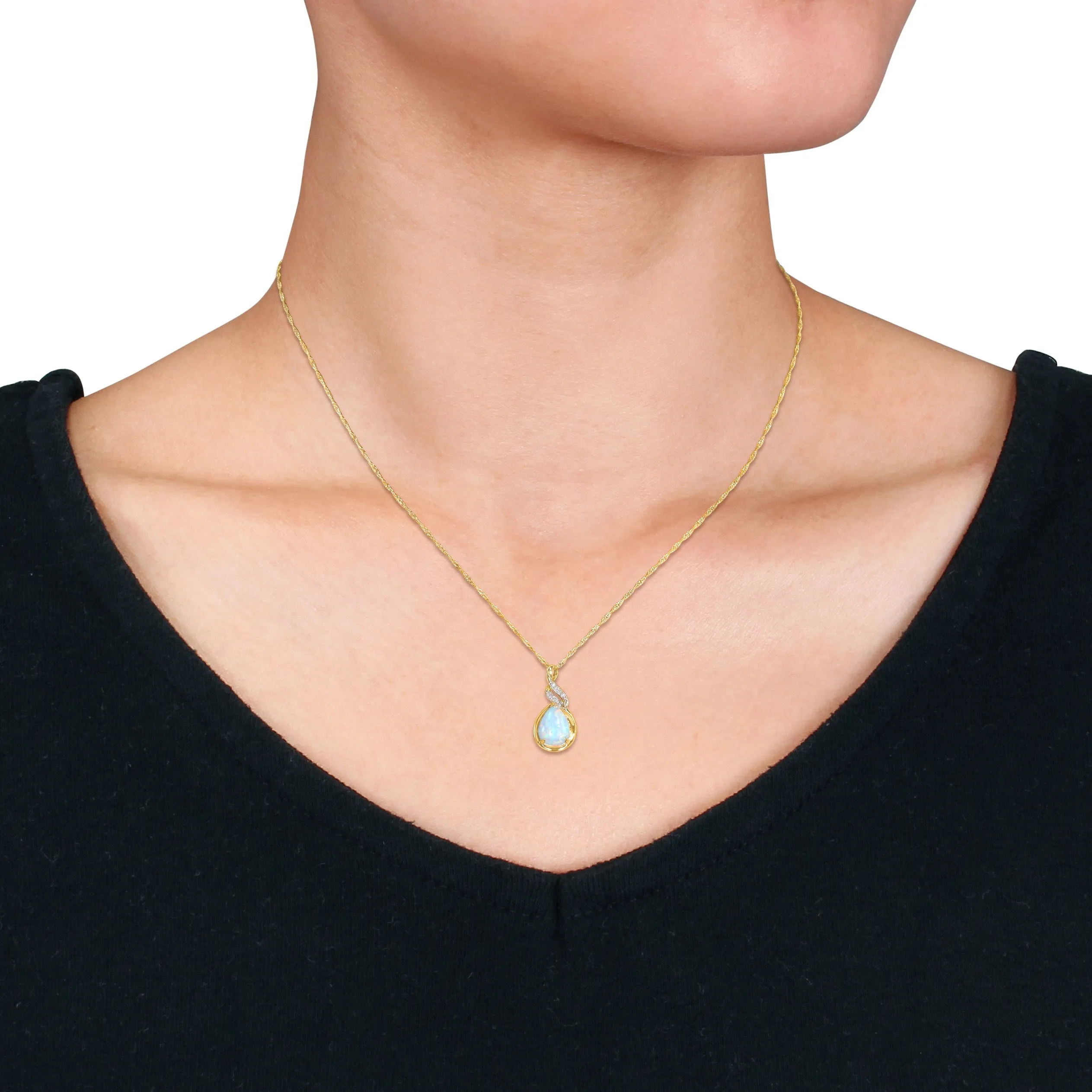 1 1/5 CT TGW Ethiopian Blue Opal and Diamond Accent Twist Pendant with Chain in 10K Yellow Gold